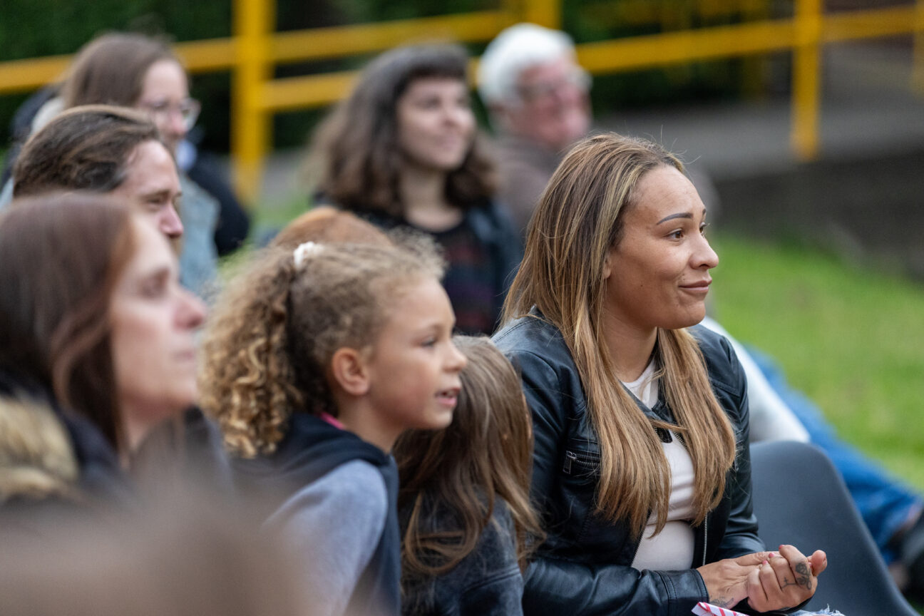 Audiences seated and watching the performances.